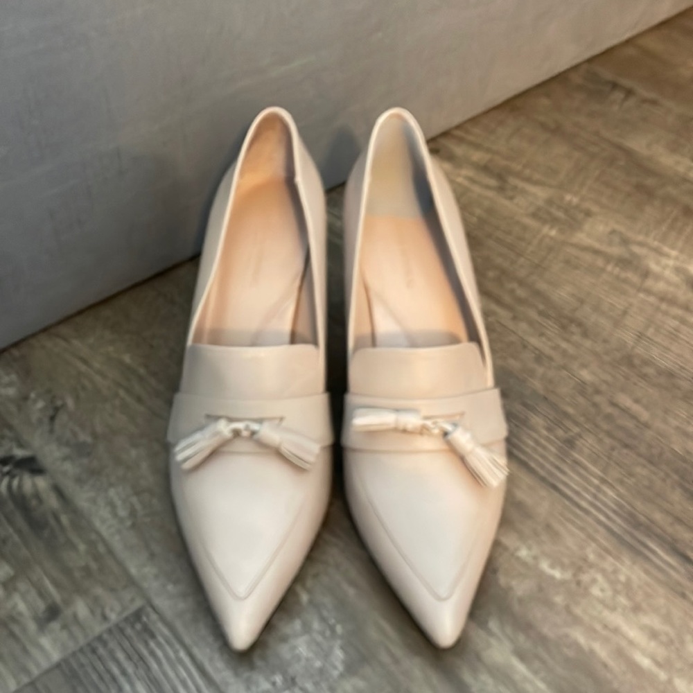 Nude high heel shoes.